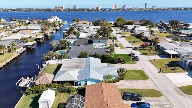 birds eye view of property with a water view