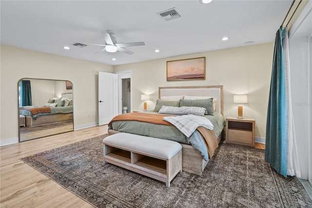 bedroom with ceiling fan and dark wood-type flooring