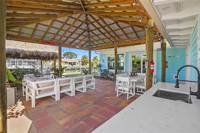 view of patio with a gazebo and sink