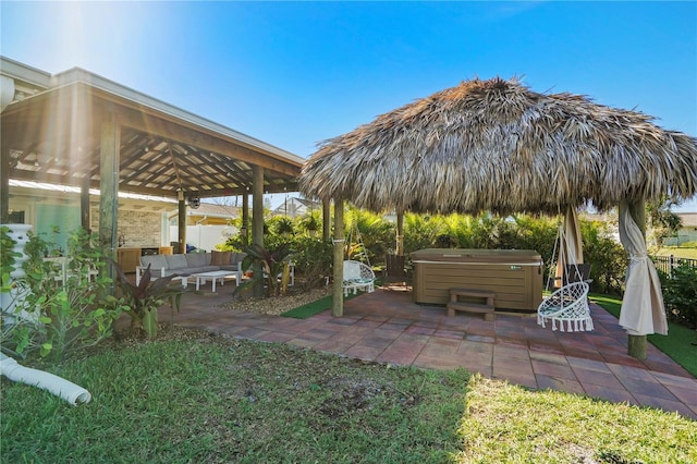 view of yard featuring an outdoor living space, a patio area, a gazebo, and a hot tub