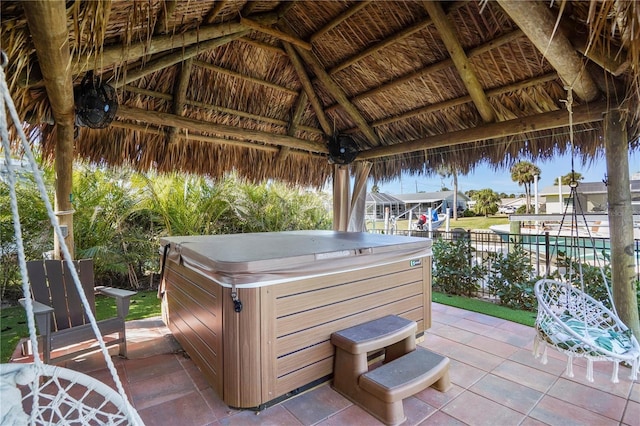 view of patio featuring a gazebo and a hot tub