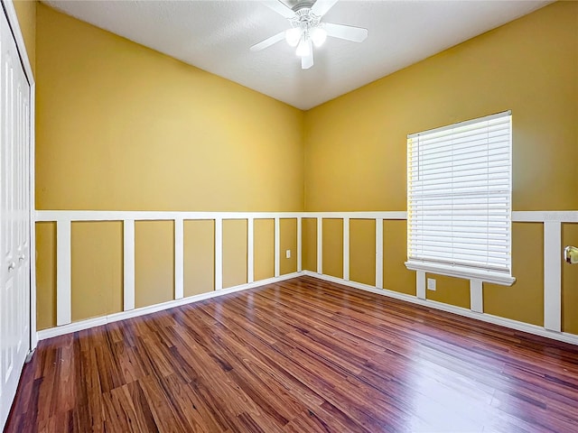 spare room with hardwood / wood-style floors and ceiling fan