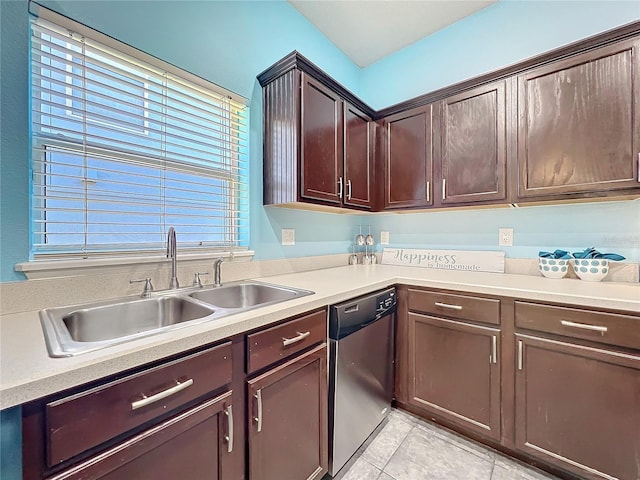 kitchen with stainless steel dishwasher, dark brown cabinetry, light tile patterned floors, and sink