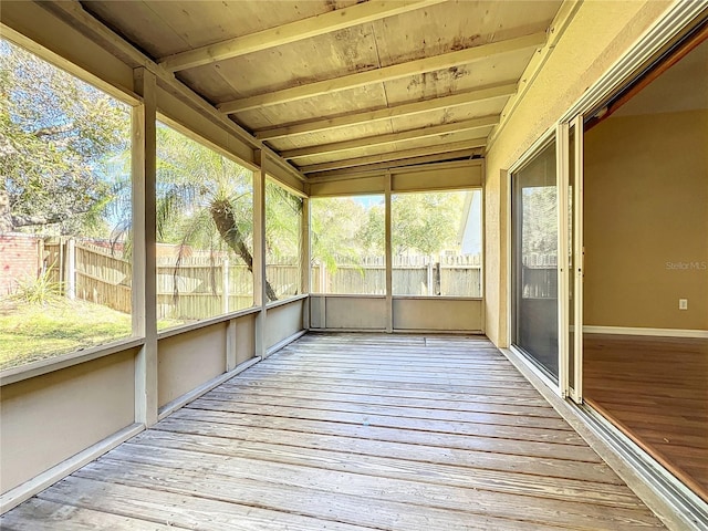 unfurnished sunroom with vaulted ceiling