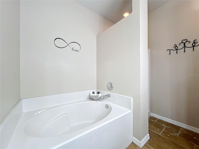 bathroom featuring a washtub