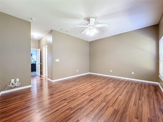 spare room featuring hardwood / wood-style flooring and ceiling fan