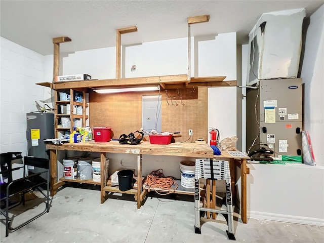 kitchen with water heater and concrete floors