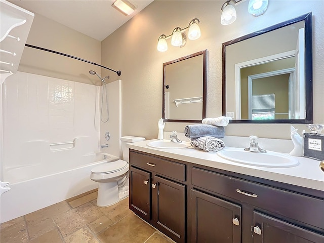 full bathroom with toilet, vanity, and tub / shower combination