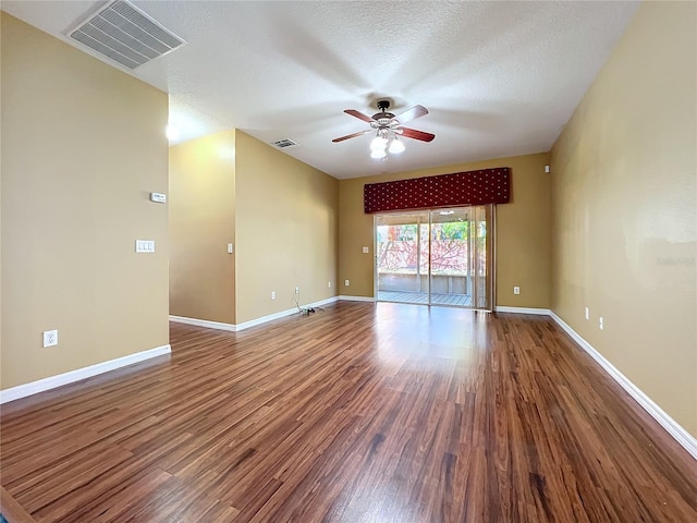 unfurnished room with ceiling fan, a textured ceiling, and hardwood / wood-style flooring