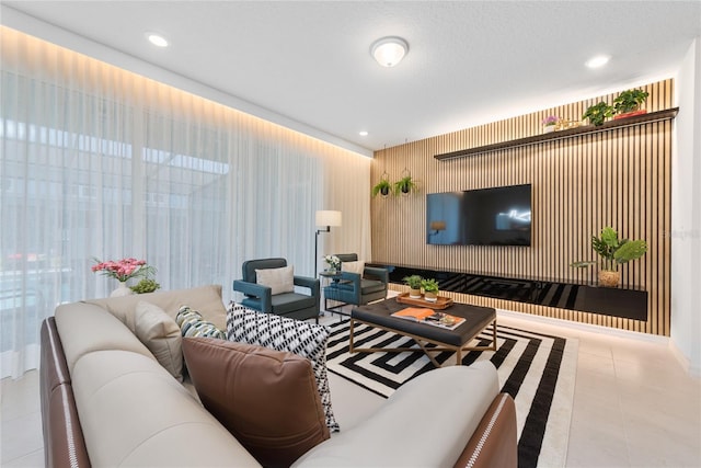 living room with light tile patterned floors and a textured ceiling