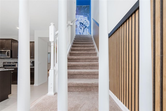 stairs with tile patterned flooring