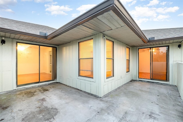 view of side of property with a patio