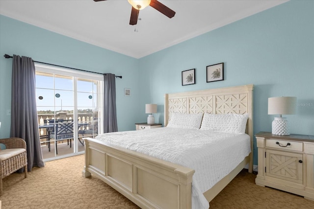 carpeted bedroom featuring ceiling fan and access to outside