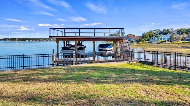 view of dock featuring a water view and a yard