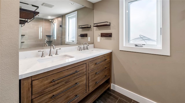 bathroom featuring vanity and walk in shower