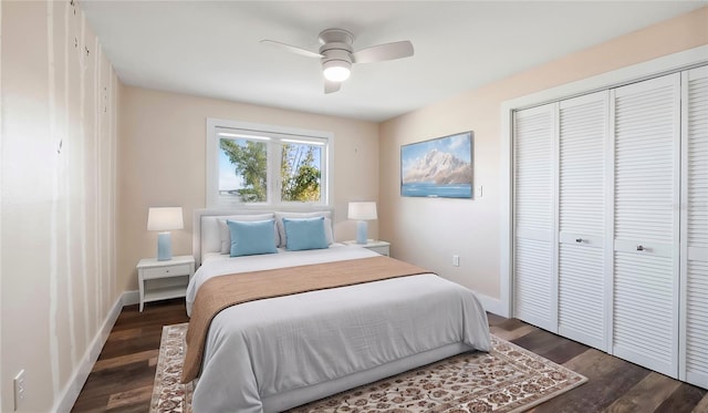 bedroom with dark wood-type flooring, a closet, and ceiling fan