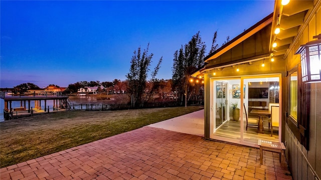 patio terrace at dusk with a water view