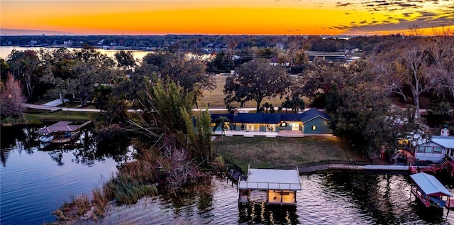 aerial view at dusk with a water view