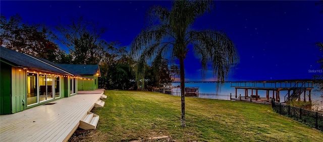 yard at night with a water view