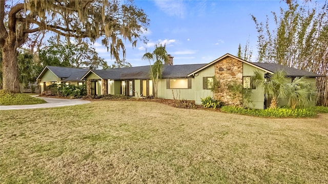 ranch-style home with a front yard