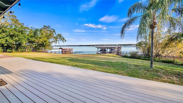 deck featuring a water view and a yard