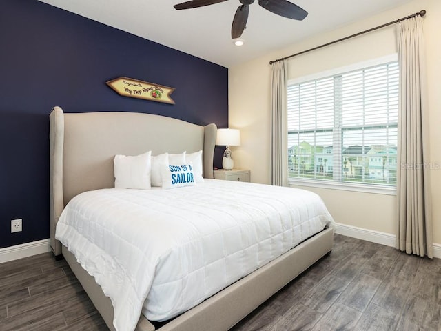 bedroom featuring ceiling fan and dark hardwood / wood-style floors