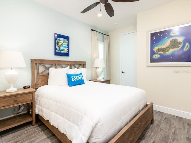 bedroom with ceiling fan and hardwood / wood-style floors