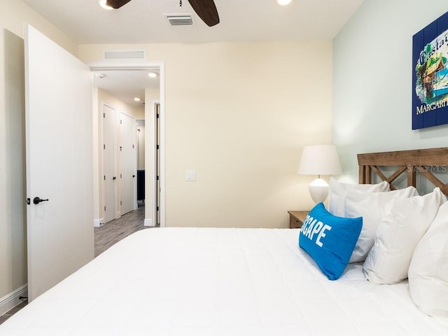 bedroom featuring hardwood / wood-style flooring and ceiling fan