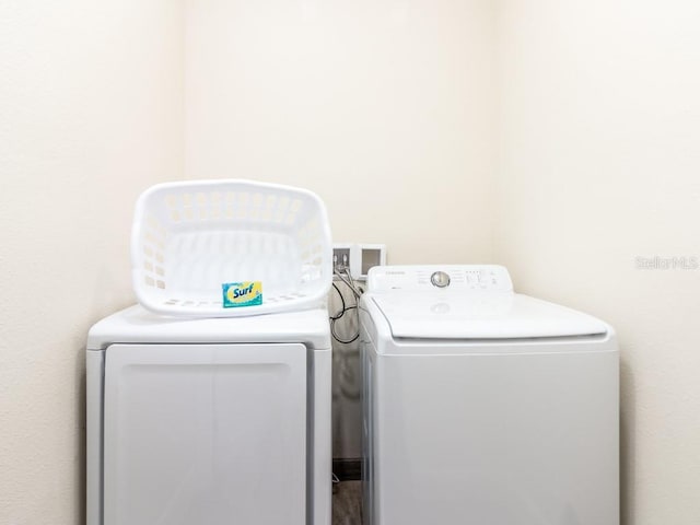 laundry room featuring washer and clothes dryer