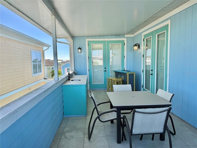 sunroom / solarium with french doors and sink