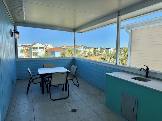 view of patio featuring a balcony and sink