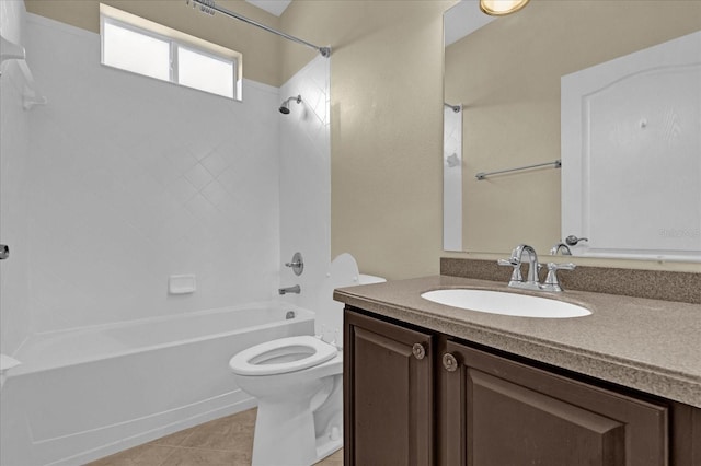 full bathroom with tile patterned flooring, vanity, tiled shower / bath combo, and toilet