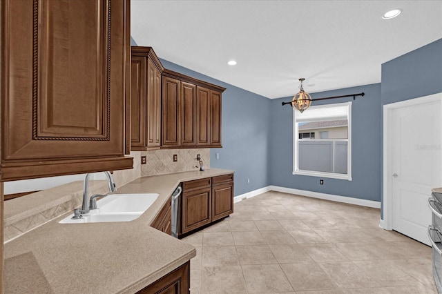 kitchen featuring sink, light tile patterned floors, decorative light fixtures, an inviting chandelier, and dishwasher