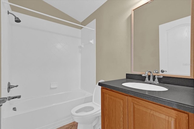 full bathroom featuring tile patterned floors,  shower combination, lofted ceiling, toilet, and vanity