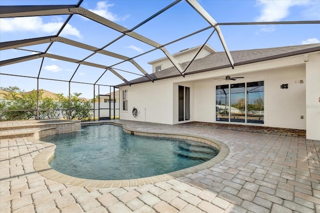 view of pool featuring an in ground hot tub, a patio area, ceiling fan, and a lanai