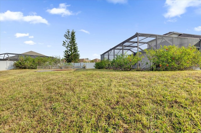 view of yard with a lanai