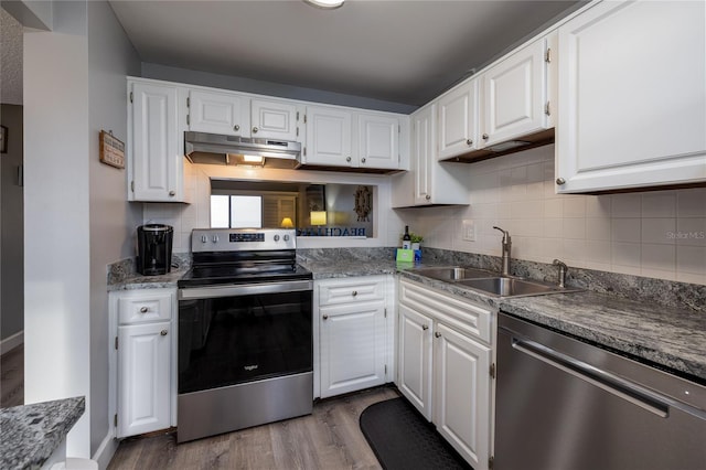 kitchen featuring white cabinets, stainless steel appliances, and sink