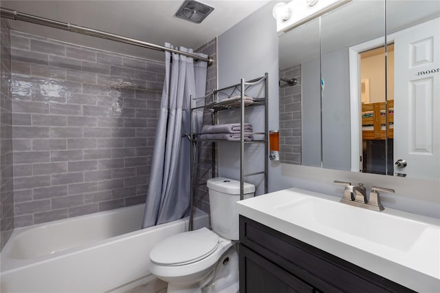 full bathroom with vanity, toilet, and shower / bath combo with shower curtain