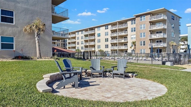 surrounding community featuring a yard and a patio