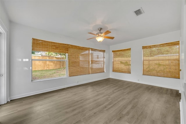 empty room featuring hardwood / wood-style floors and ceiling fan