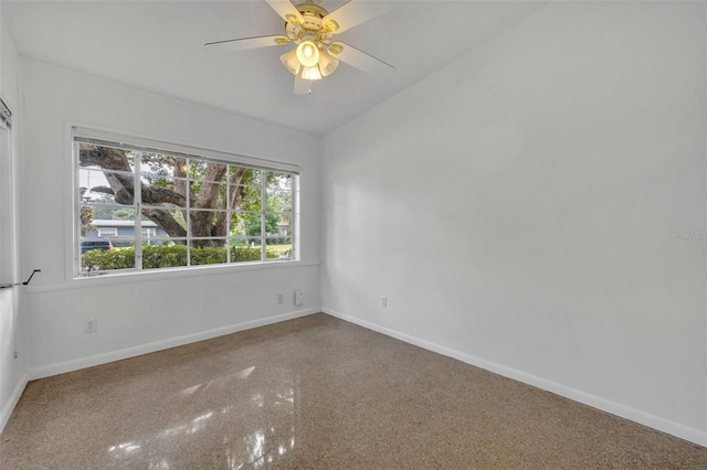 spare room featuring ceiling fan and lofted ceiling