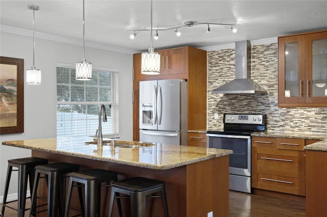 kitchen with appliances with stainless steel finishes, sink, backsplash, crown molding, and wall chimney exhaust hood