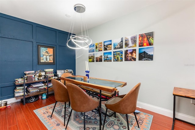 dining space featuring hardwood / wood-style flooring