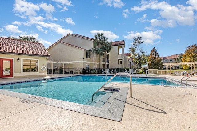 view of swimming pool featuring a patio