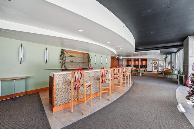 bar featuring light tile patterned floors