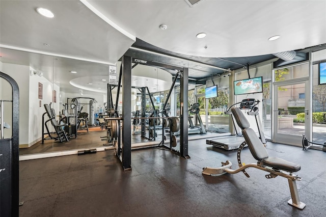 gym with floor to ceiling windows