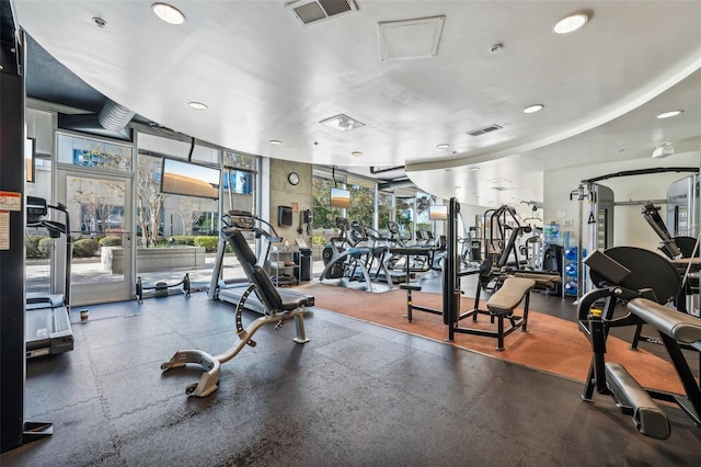 workout area with a wall of windows