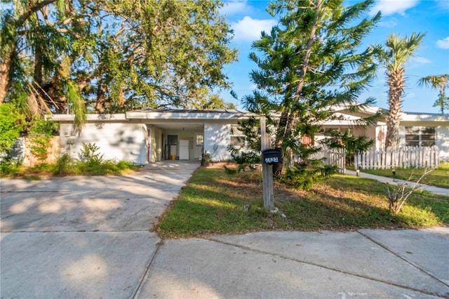 2695 S E Ave, Sarasota, FL 34239 - view of front facade with concrete driveway and an attached carport
