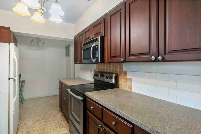 kitchen with decorative light fixtures, stainless steel appliances, tasteful backsplash, and a notable chandelier