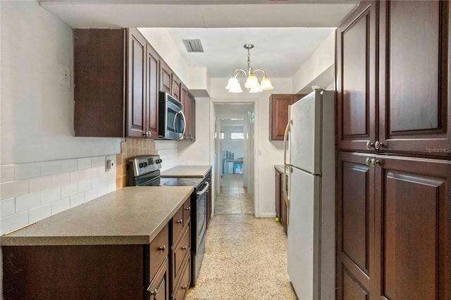 kitchen with a notable chandelier, backsplash, pendant lighting, dark brown cabinets, and appliances with stainless steel finishes